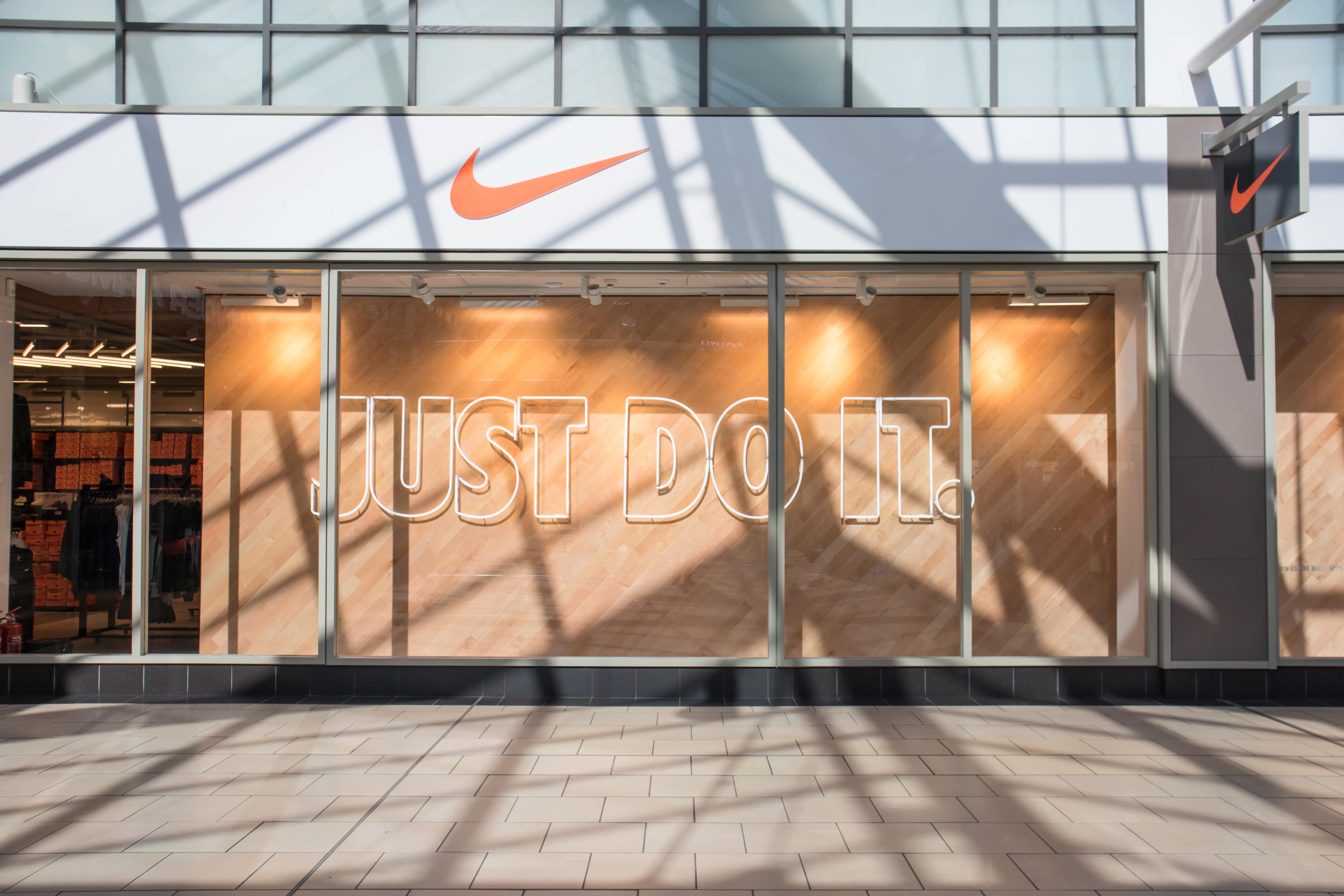 Nike store with just do it logo hanging at the top
